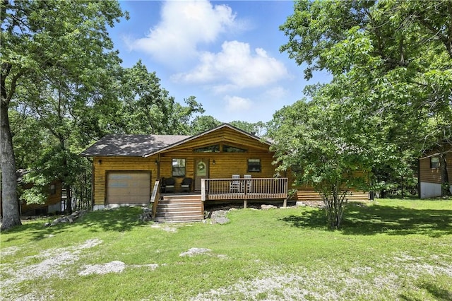 22562 Air Park, Golden, MO 65658 - view of front of home with a garage, a front yard, and a deck