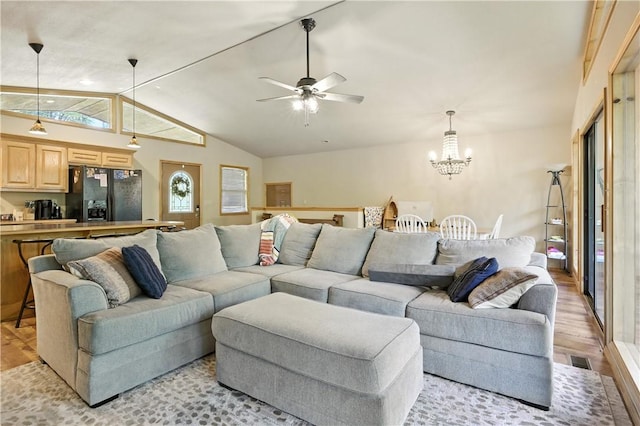 22562 Air Park, Golden, MO 65658 - living area with light wood finished floors, lofted ceiling, a chandelier, and ceiling fan