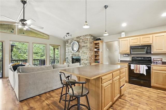 22562 Air Park, Golden, MO 65658 - kitchen featuring black appliances, light wood finished floors, open floor plan, ceiling fan, and lofted ceiling