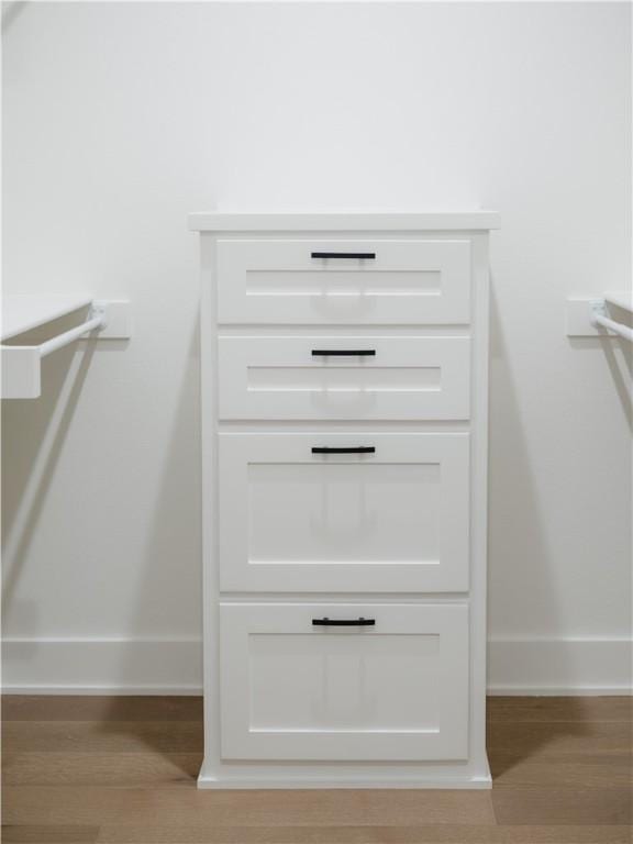 1316 Bella Vista Rd, Bentonville, AR 72712 - detailed view of baseboards and wood finished floors