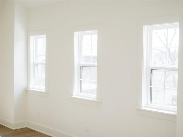 1316 Bella Vista Rd, Bentonville, AR 72712 - spare room featuring healthy amount of natural light and wood finished floors