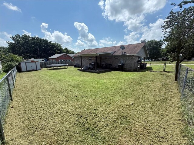 604 W Carver St, Ozark, AR 72949 - fenced backyard featuring a storage shed