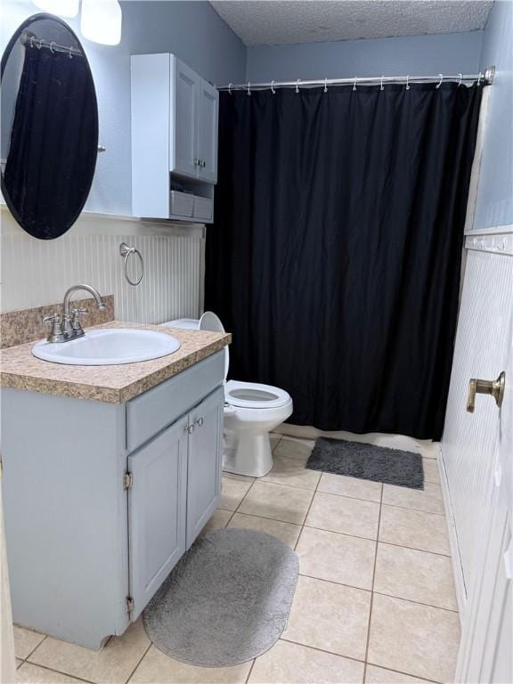 604 W Carver St, Ozark, AR 72949 - full bath with vanity, tile patterned floors, a textured ceiling, and a shower with curtain