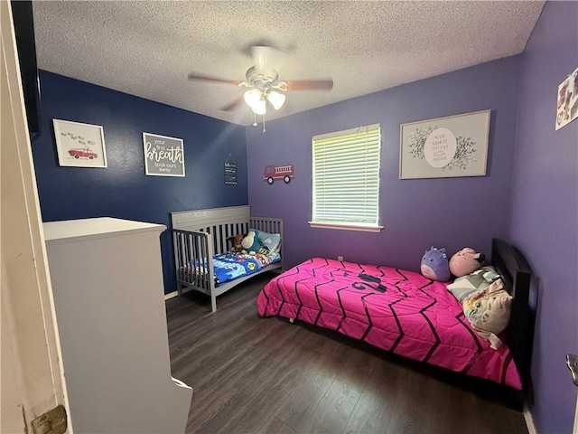 604 W Carver St, Ozark, AR 72949 - bedroom with wood finished floors, a textured ceiling, and ceiling fan