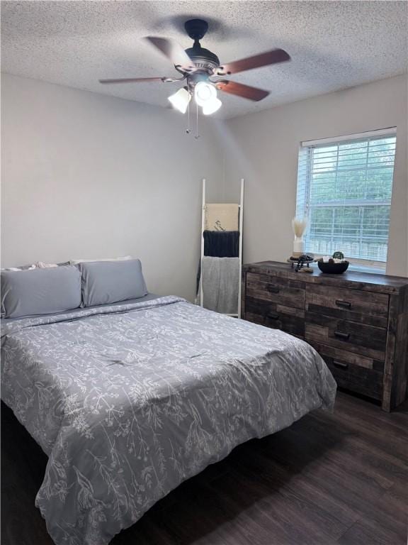 604 W Carver St, Ozark, AR 72949 - bedroom featuring wood finished floors, a textured ceiling, and ceiling fan