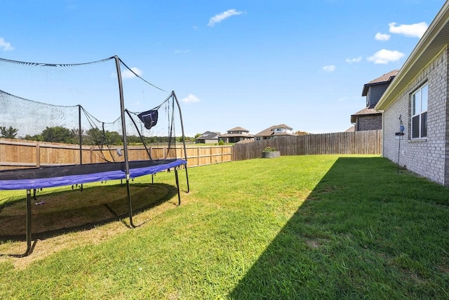 1251 Bootleg Rd, Centerton, AR 72719 - fenced backyard with a trampoline