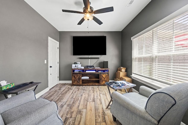 1251 Bootleg Rd, Centerton, AR 72719 - living room with plenty of natural light, ceiling fan, and wood finished floors