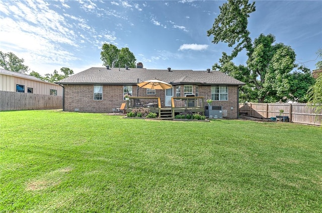 1303 W Pine St, Rogers, AR 72758 - rear view of house with brick siding, a fenced backyard, and a wooden deck