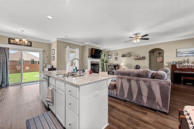 477 Caballo St, Farmington, AR 72730 - kitchen with open floor plan, a fireplace, a chandelier, a kitchen island with sink, and stainless steel dishwasher