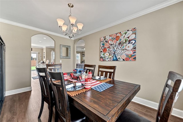477 Caballo St, Farmington, AR 72730 - dining space with arched walkways, wood finished floors, crown molding, and a chandelier