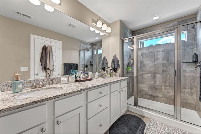 477 Caballo St, Farmington, AR 72730 - bathroom featuring double vanity, a shower stall, and tile patterned floors