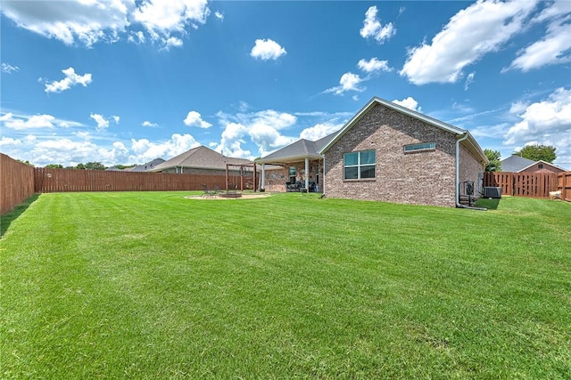 477 Caballo St, Farmington, AR 72730 - rear view of house with a fenced backyard, a patio, and brick siding