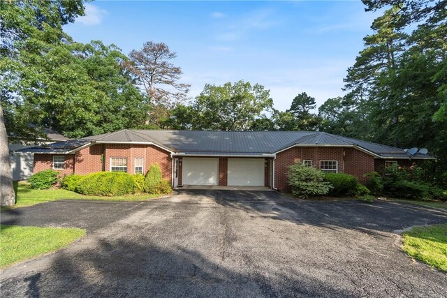 17 Pivot Rock Rd Unit 5, Eureka Springs, AR 72632 - single story home featuring an attached garage, brick siding, asphalt driveway, and a metal roof