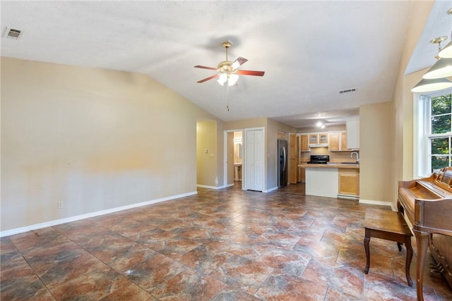 17 Pivot Rock Rd Unit 5, Eureka Springs, AR 72632 - unfurnished living room with dark stone finish floors, ceiling fan, and vaulted ceiling