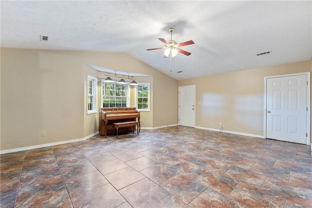 17 Pivot Rock Rd Unit 5, Eureka Springs, AR 72632 - spare room with a ceiling fan, vaulted ceiling, and stone finish floors