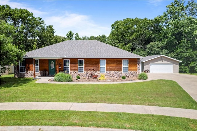 950 Nemett Cir, Pea Ridge, AR 72751 - view of front of house featuring stone siding, a detached garage, a front yard, and an outbuilding