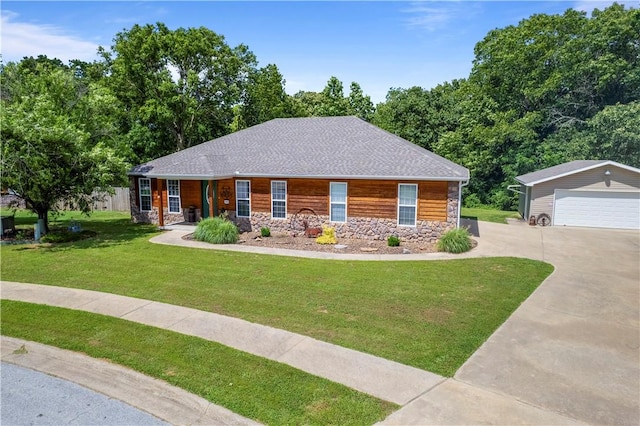950 Nemett Cir, Pea Ridge, AR 72751 - view of front facade with stone siding, an outdoor structure, a garage, and a front yard