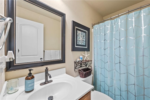 950 Nemett Cir, Pea Ridge, AR 72751 - bathroom with vanity, a shower with shower curtain, and a textured wall