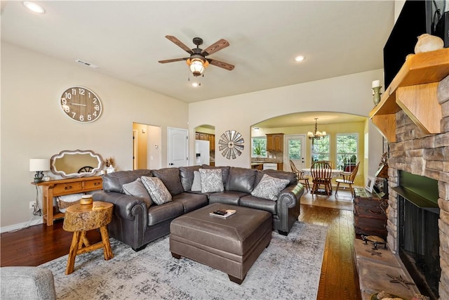 950 Nemett Cir, Pea Ridge, AR 72751 - living room featuring arched walkways, hardwood / wood-style flooring, a ceiling fan, a chandelier, and recessed lighting