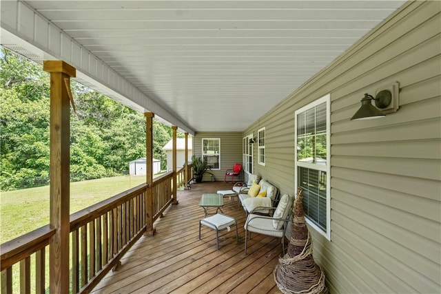 950 Nemett Cir, Pea Ridge, AR 72751 - wooden deck featuring a yard and a shed