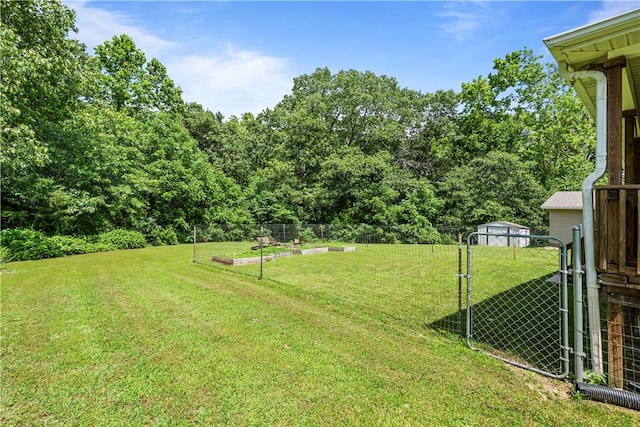 950 Nemett Cir, Pea Ridge, AR 72751 - view of yard featuring a vegetable garden