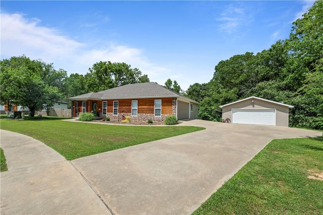 950 Nemett Cir, Pea Ridge, AR 72751 - view of front of house featuring stone siding, a garage, and an outbuilding