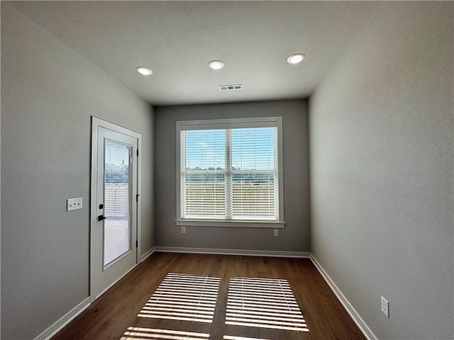 4807 SW Wakanda St, Bentonville, AR 72713 - unfurnished room featuring dark wood-style floors and recessed lighting