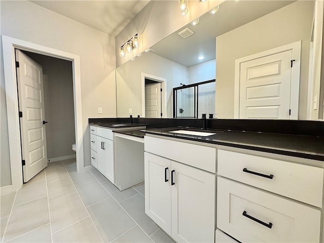 4807 SW Wakanda St, Bentonville, AR 72713 - full bathroom featuring vanity, a shower stall, and tile patterned flooring