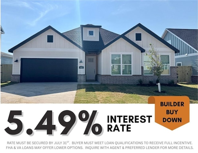 4807 SW Wakanda St, Bentonville, AR 72713 - view of front of house with board and batten siding, a garage, brick siding, concrete driveway, and a shingled roof