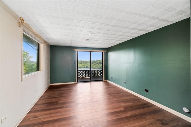 409 Hillcrest Rd, Eureka Springs, AR 72631 - unfurnished room featuring wood finished floors and baseboards