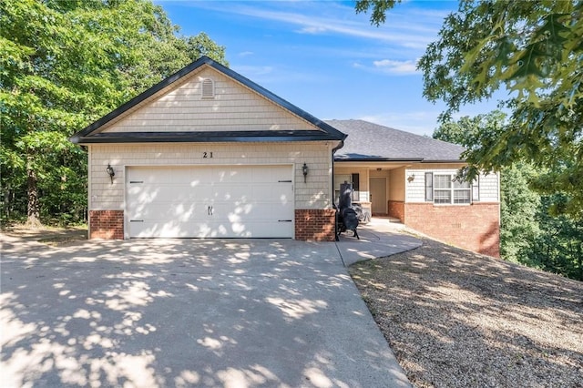 21 Cherhill Dr, Bella Vista, AR 72714 - ranch-style home with brick siding, concrete driveway, and a garage