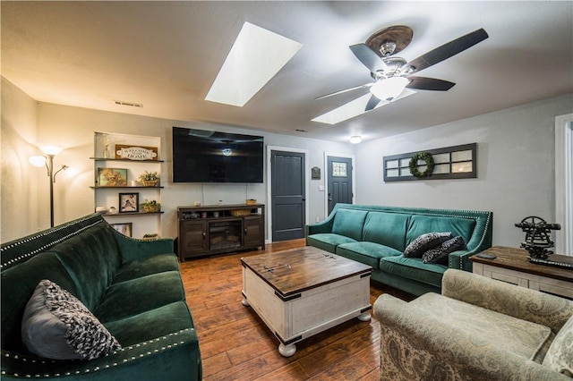 21569 Sibley Rd, Sulphur Springs, AR 72768 - living room featuring a skylight, dark wood-style floors, and ceiling fan