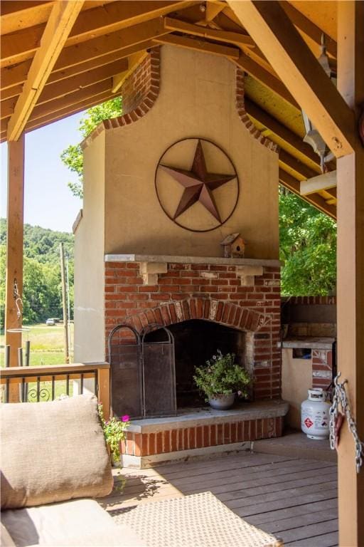 21569 Sibley Rd, Sulphur Springs, AR 72768 - view of patio / terrace featuring an outdoor brick fireplace and a deck