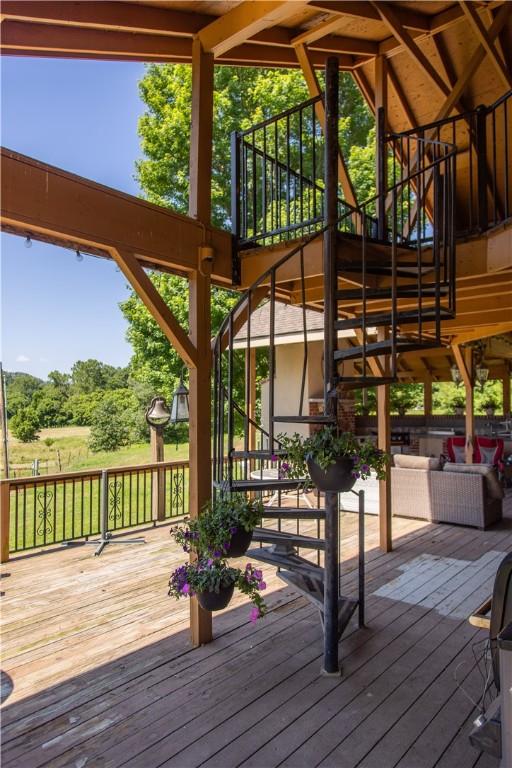 21569 Sibley Rd, Sulphur Springs, AR 72768 - wooden terrace featuring stairway and an outdoor hangout area