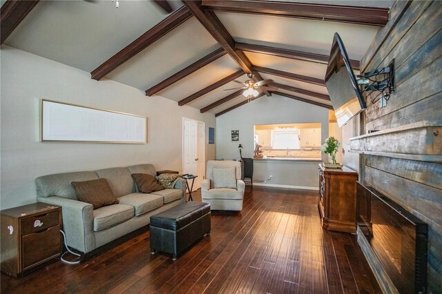 704 NW 8th St, Bentonville, AR 72712 - living area with dark wood finished floors, a ceiling fan, and a fireplace