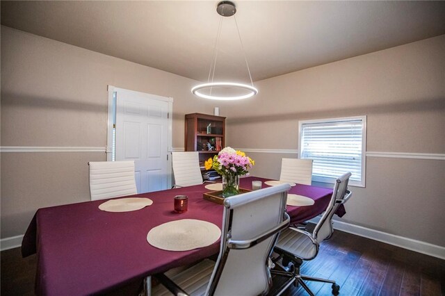 704 NW 8th St, Bentonville, AR 72712 - dining space with baseboards and wood-type flooring