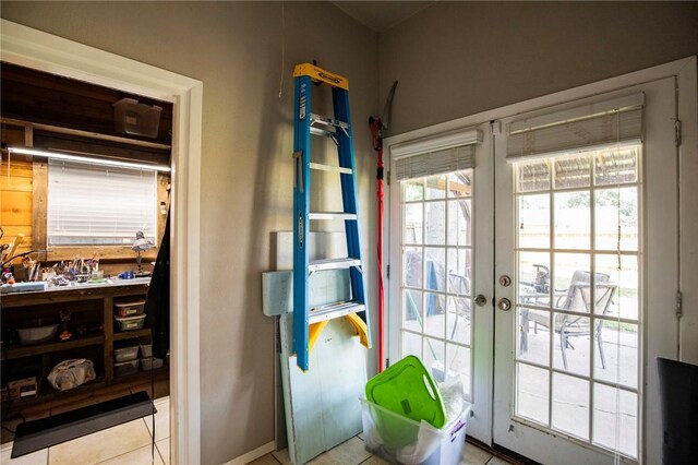 704 NW 8th St, Bentonville, AR 72712 - entryway with tile patterned flooring and french doors