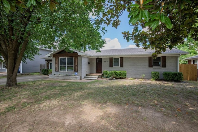 704 NW 8th St, Bentonville, AR 72712 - single story home with brick siding and driveway