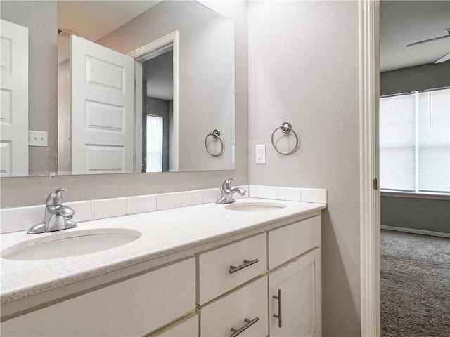 4082 W Sardinia Way, Fayetteville, AR 72704 - bathroom featuring double vanity and a textured wall