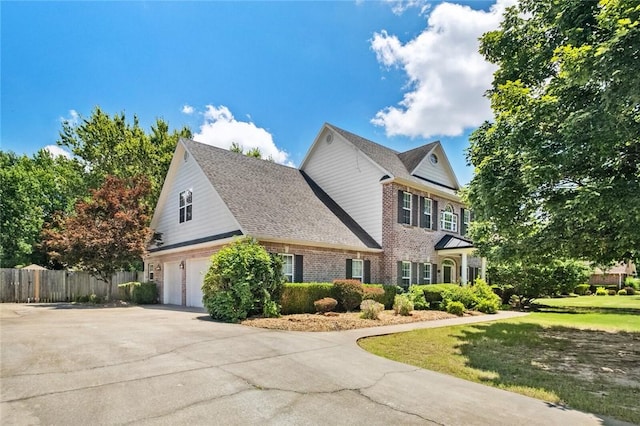 1754 N Hartford Dr, Fayetteville, AR 72701 - traditional home featuring brick siding, driveway, and roof with shingles