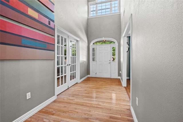 1754 N Hartford Dr, Fayetteville, AR 72701 - entrance foyer featuring wood finished floors, french doors, and a towering ceiling