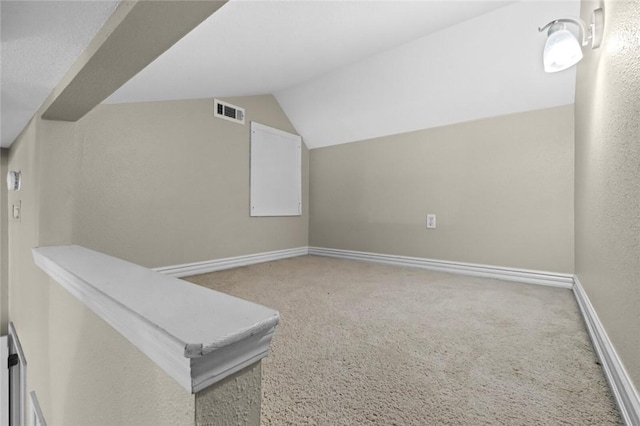 1754 N Hartford Dr, Fayetteville, AR 72701 - additional living space featuring carpet flooring and vaulted ceiling