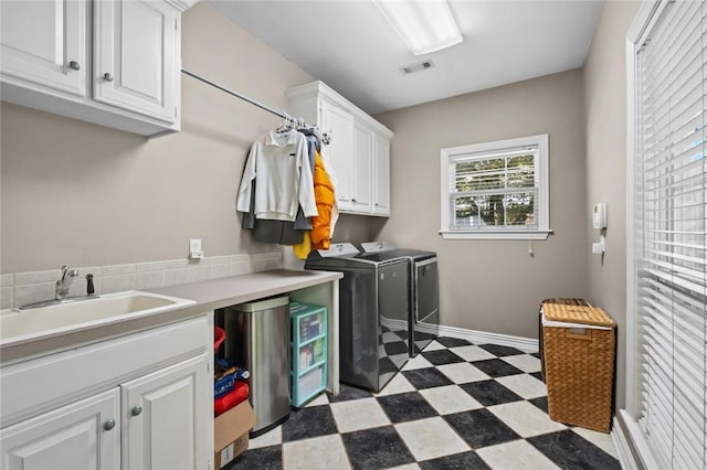 1754 N Hartford Dr, Fayetteville, AR 72701 - washroom with cabinet space, washer and dryer, and dark flooring