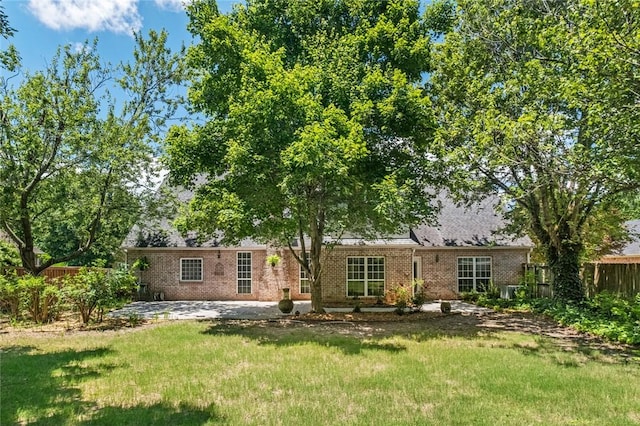 1754 N Hartford Dr, Fayetteville, AR 72701 - back of property featuring brick siding and a patio