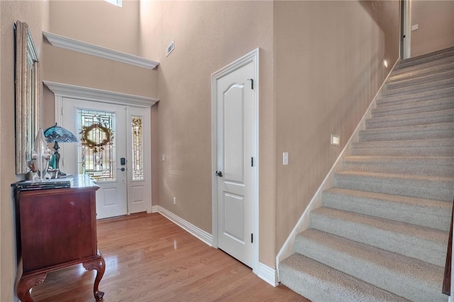 1531 Partridge Run, Bentonville, AR 72713 - foyer entrance with wood finished floors, stairs, and a high ceiling
