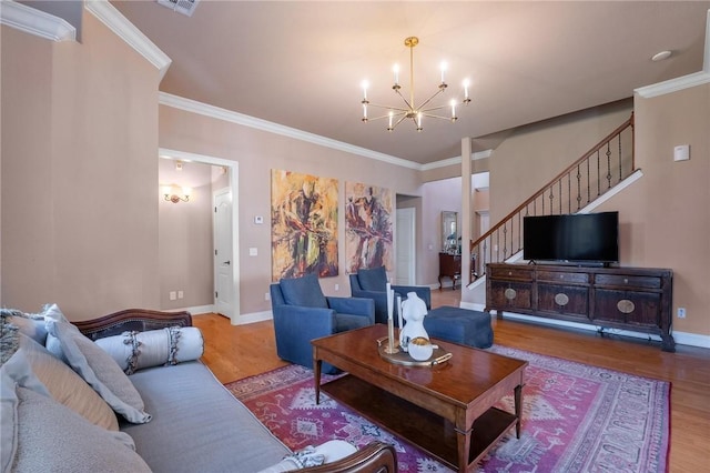 1531 Partridge Run, Bentonville, AR 72713 - living room featuring wood finished floors, a chandelier, stairway, and ornamental molding