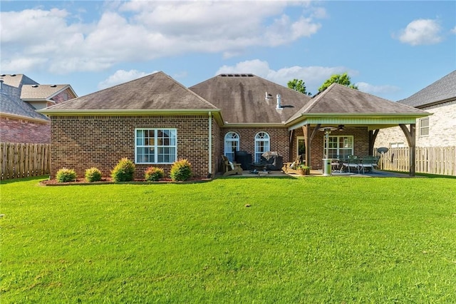 1531 Partridge Run, Bentonville, AR 72713 - back of property featuring ceiling fan, brick siding, a fenced backyard, and a patio