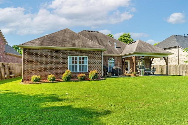 1531 Partridge Run, Bentonville, AR 72713 - rear view of property featuring brick siding, ceiling fan, a fenced backyard, and a patio area