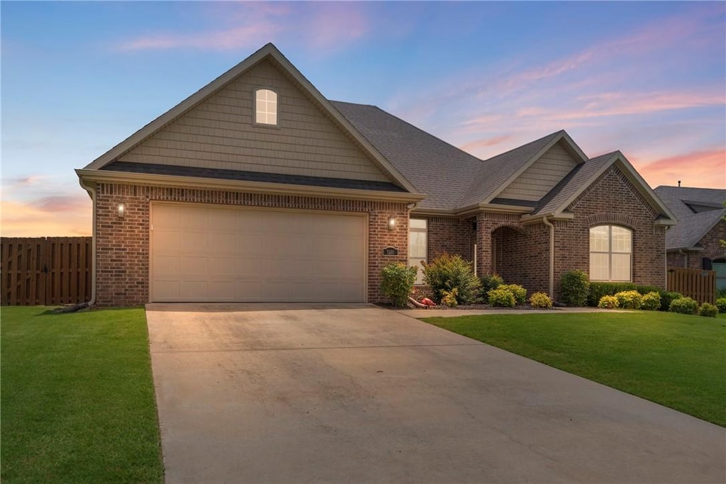 5911 S 66th St, Cave Springs, AR 72718 - view of front of house with brick siding, concrete driveway, and a garage