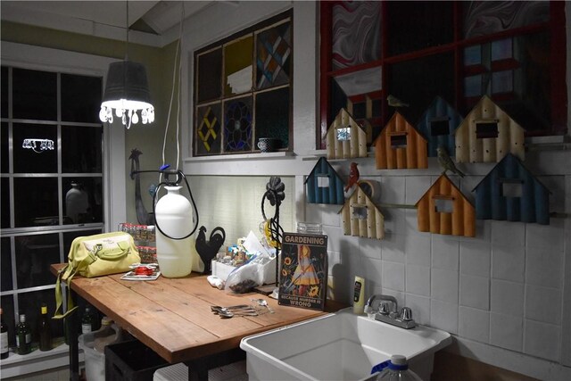 19641 Conestoga Rd, Elkins, AR 72727 - kitchen featuring a sink and decorative backsplash